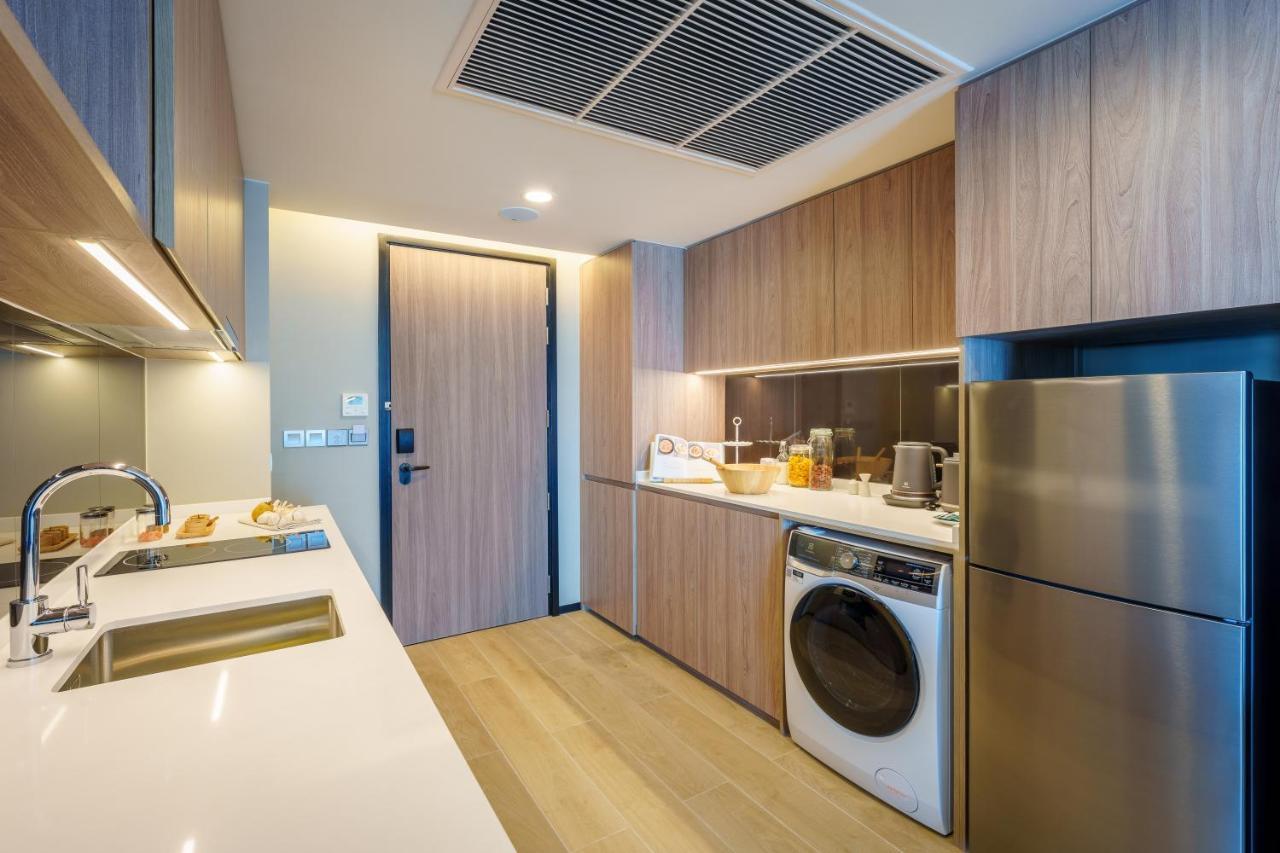 Somerset Pattaya Exteriör bild A kitchen in a 3-bedroom unit